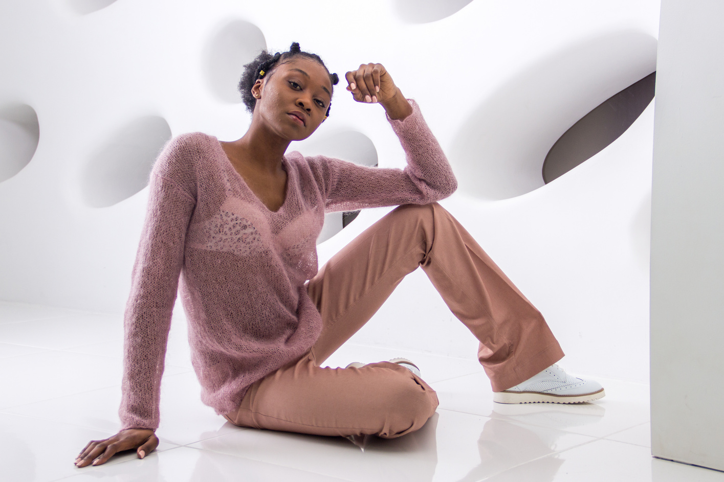 Woman with Bantu Knots Sitting on Floor